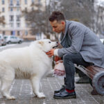 A men is showing love to his dog pet | petcareinf review
